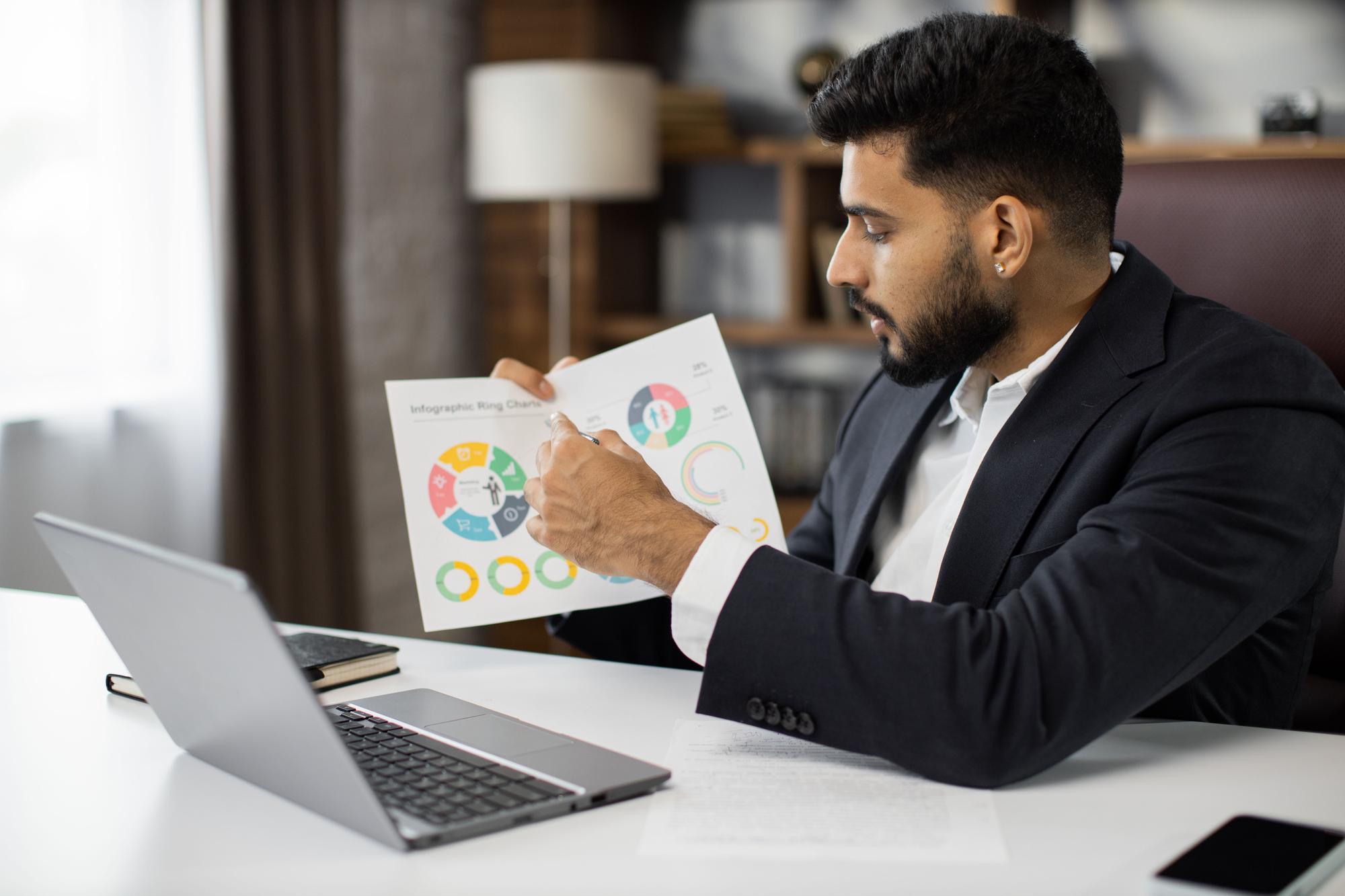 serious-marketing-professional-man-suit-talking-client-video-call